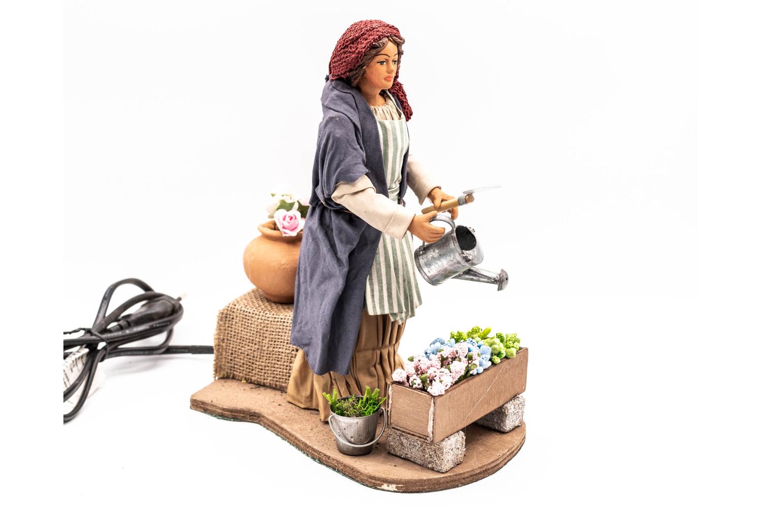 Donna Annaffia i Fiori - H 24 CM - Movimento - 24 cm